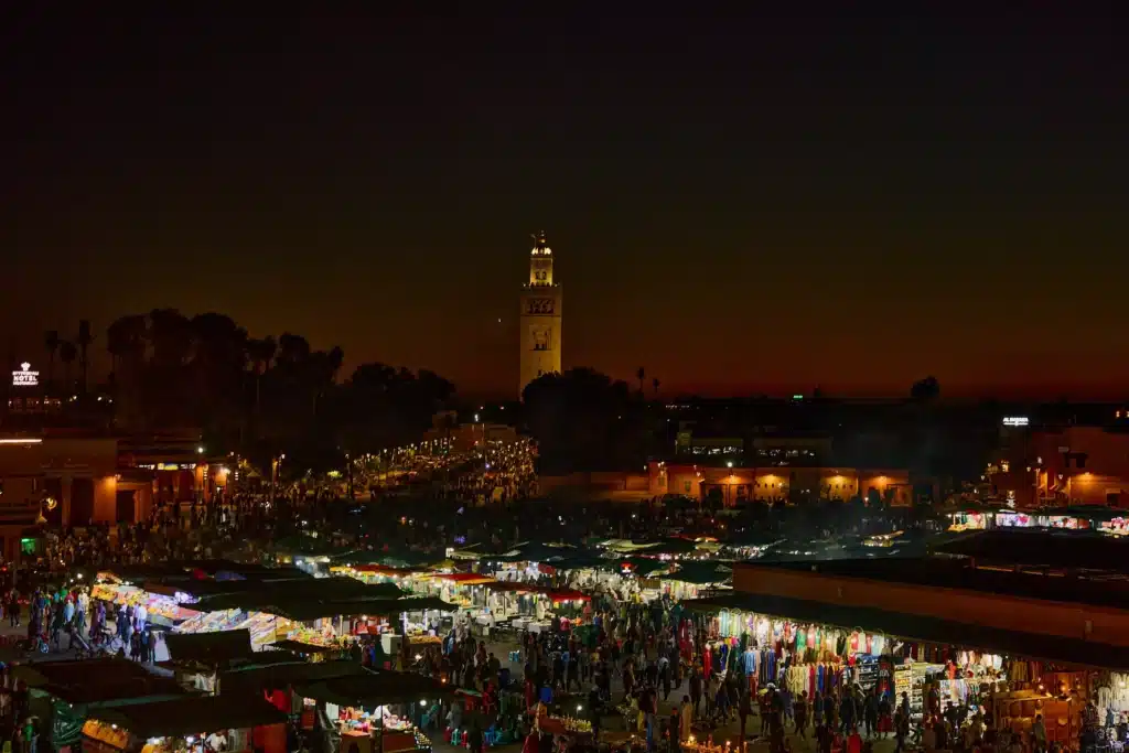 Must-See Attractions Marrakech: 10 Ultimate Luxury Highlights 2 Rooftop restaurant with view of Jemaa el-Fnaa square at sunset